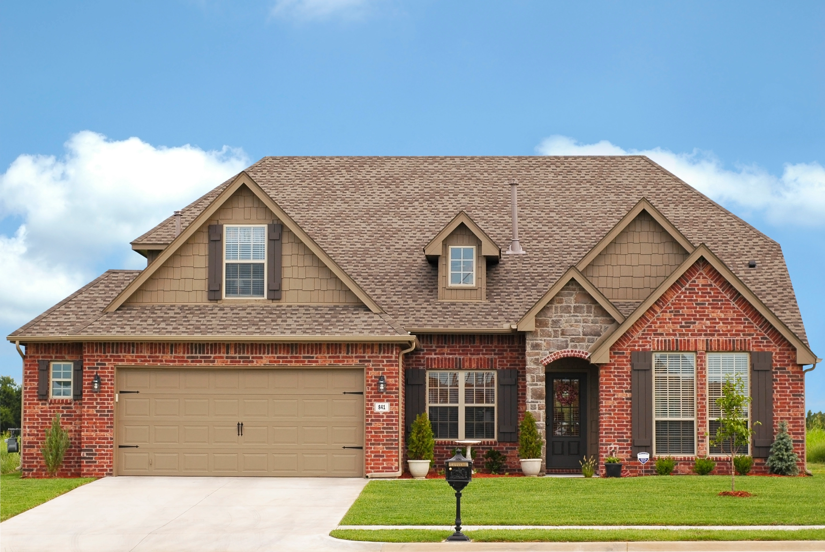 Exterior Shot of Red Brick Home.