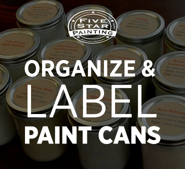 Paint cans neatly organized and labeled.