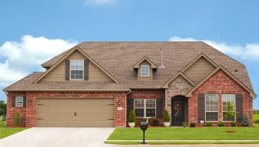Exterior Shot of Red Brick Home.