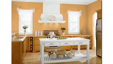 Kitchen with light orange walls and white accents