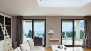 Photo of a living room beneath a large skylight